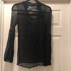 Free People sheer black turtleneck.